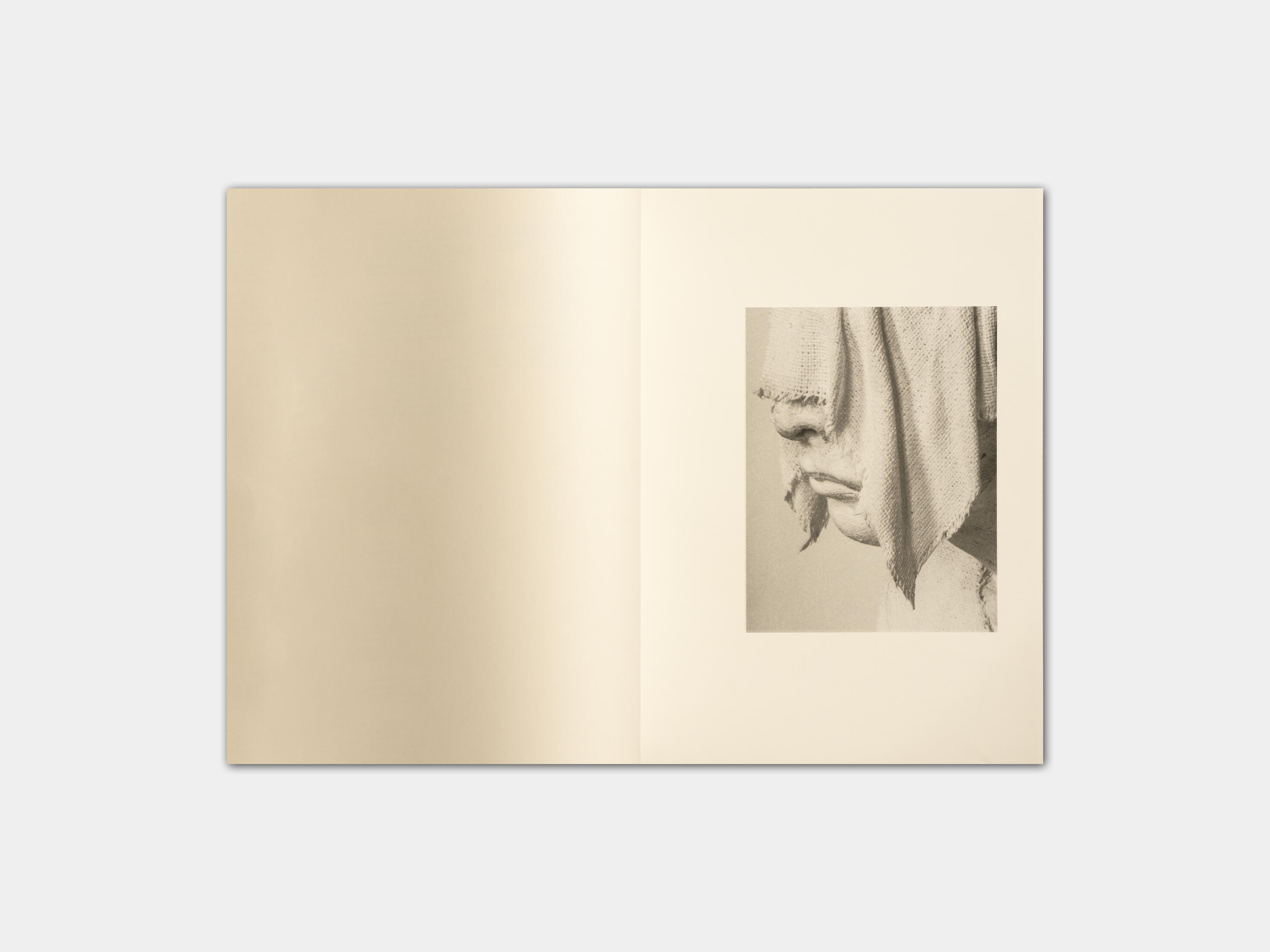 art book with sculpture of a baby by Gabrielle Carrère