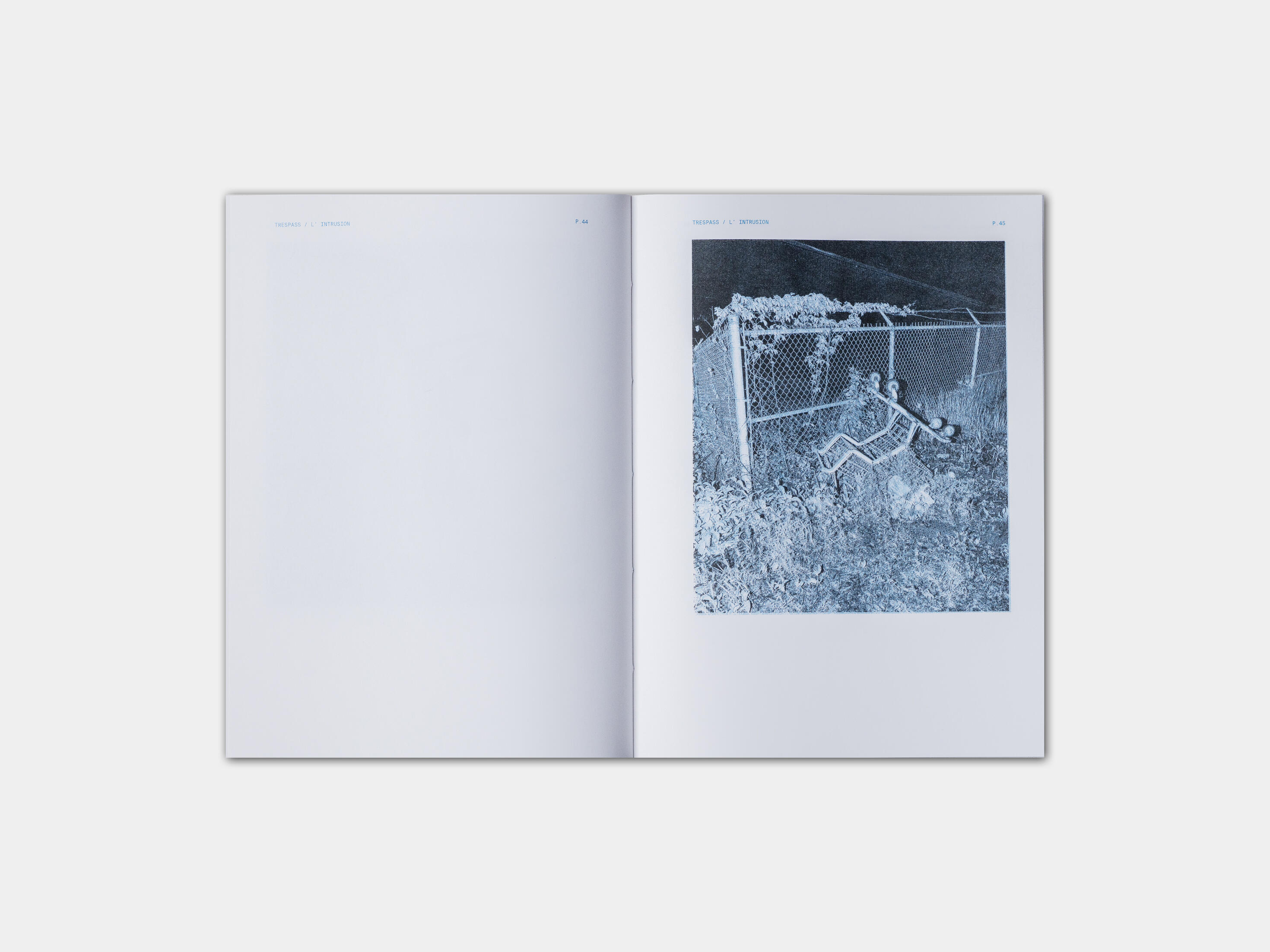 art book with street photography of fence at night