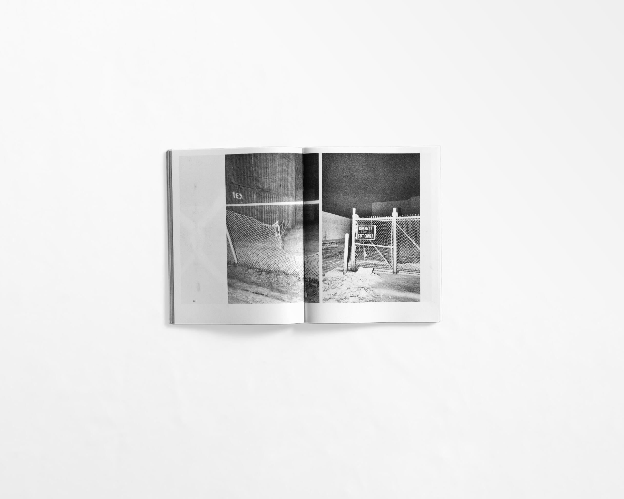 art book with street photography of fence at night