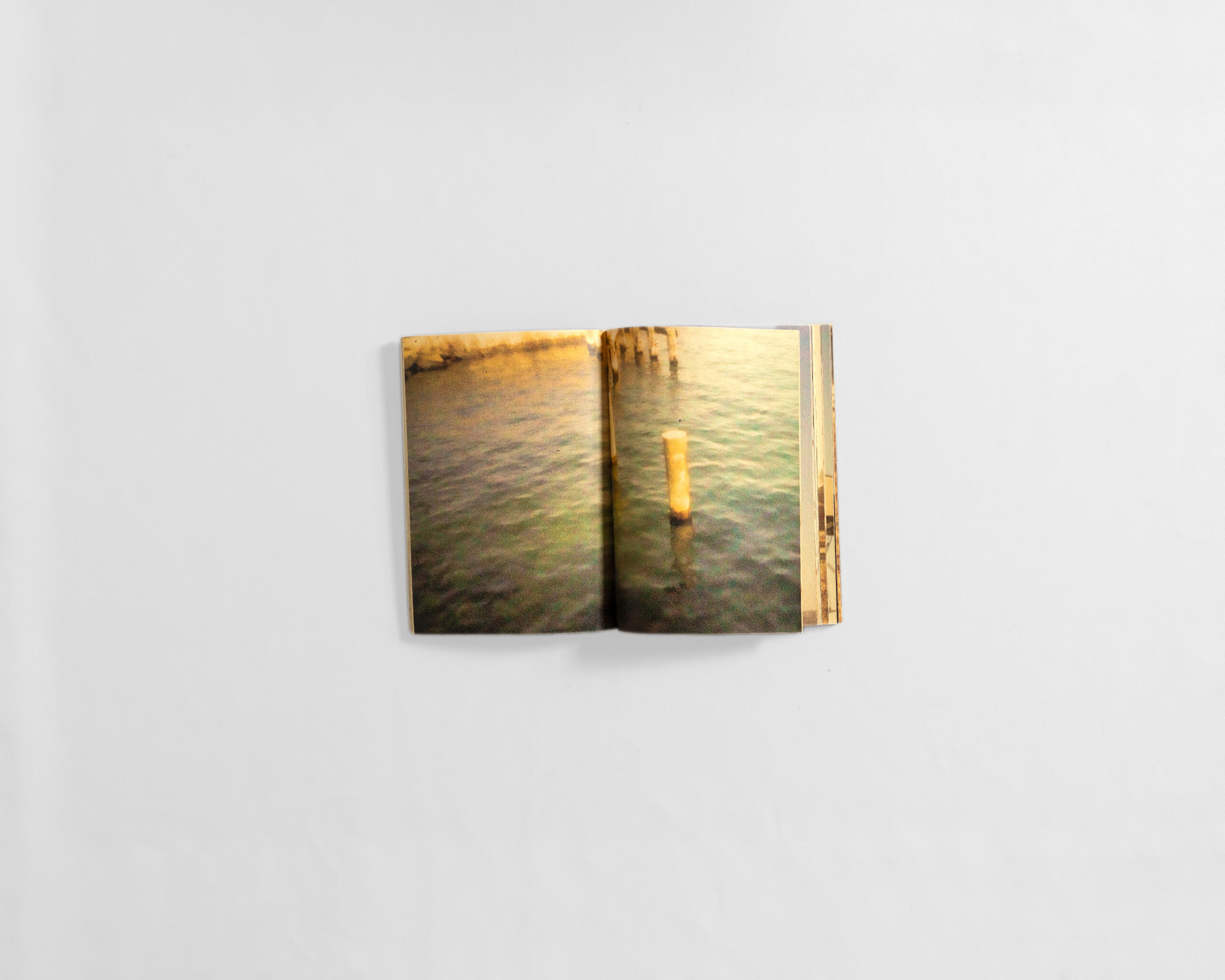 art book with fuzzy colourful image of water