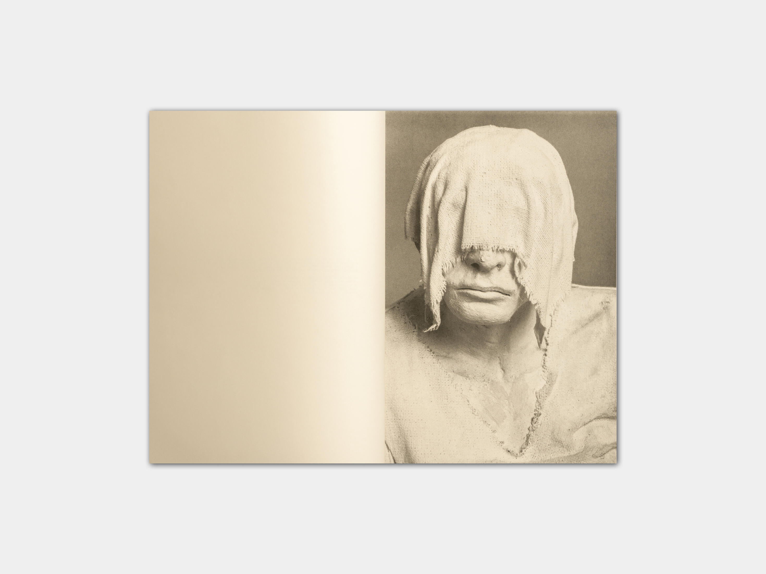 art book with sculpture of a feast by Gabrielle Carrère