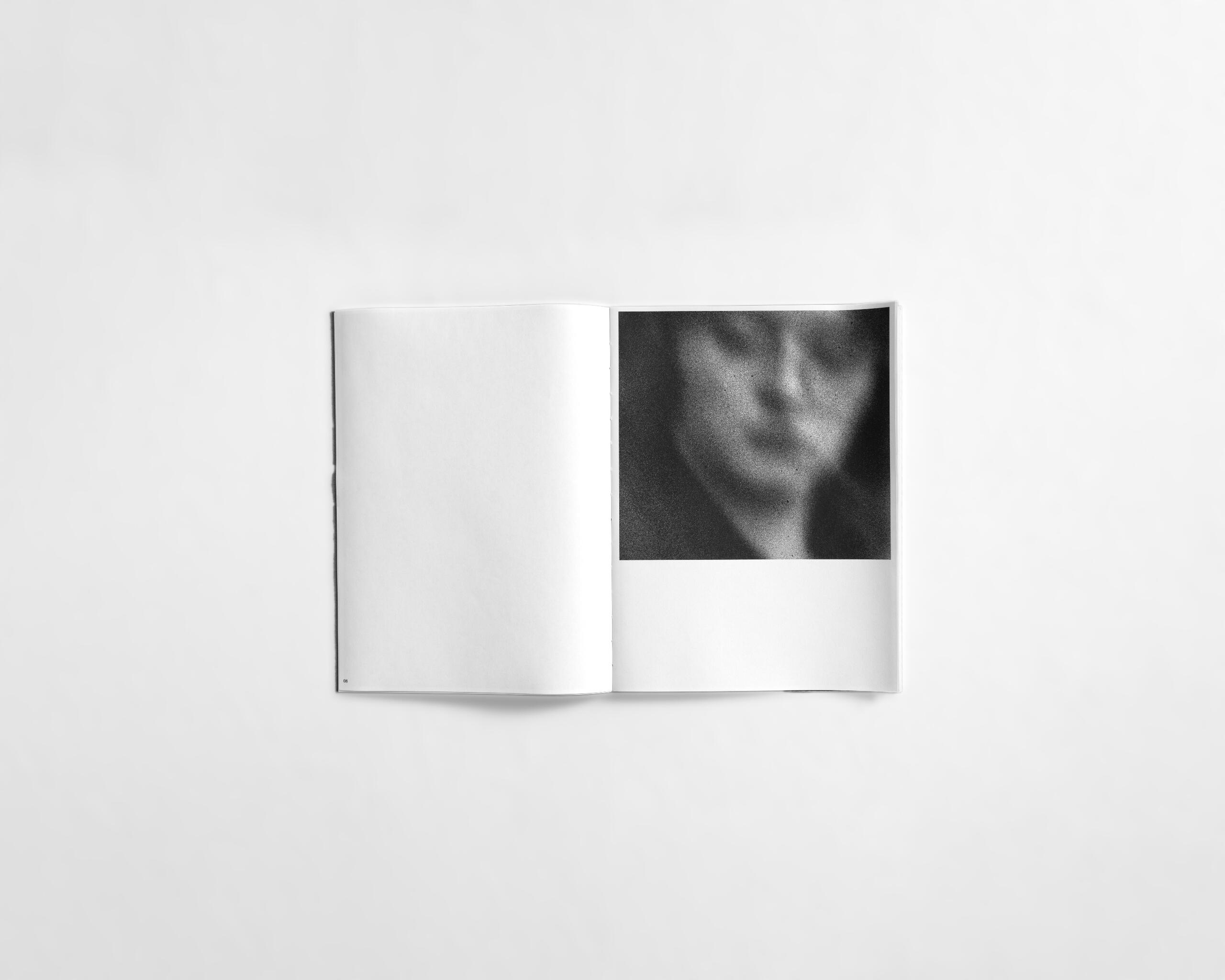 art book with abstract black and white image of a womans face