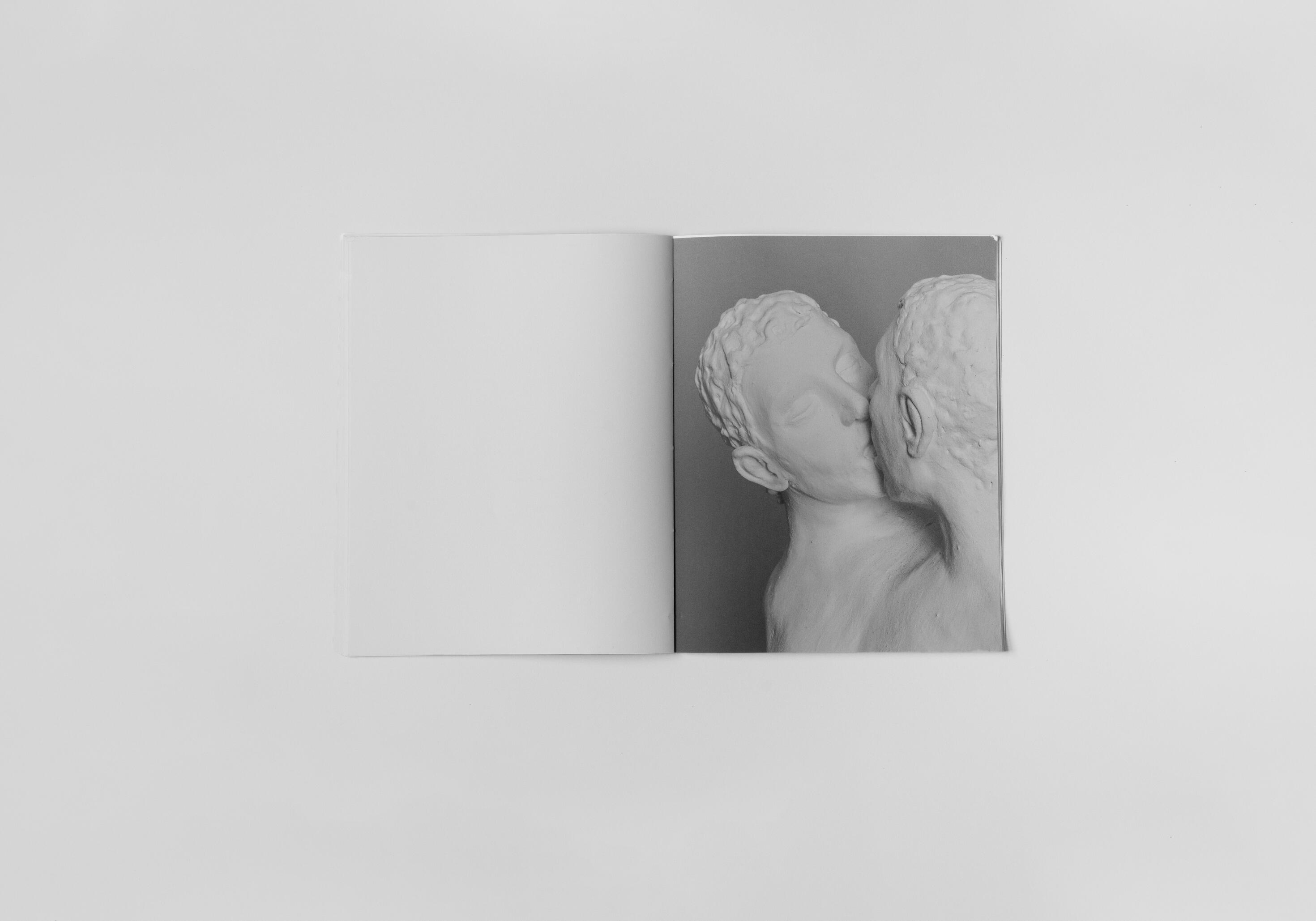 art book with sculpture of two people kissing by Gabrielle Carrère