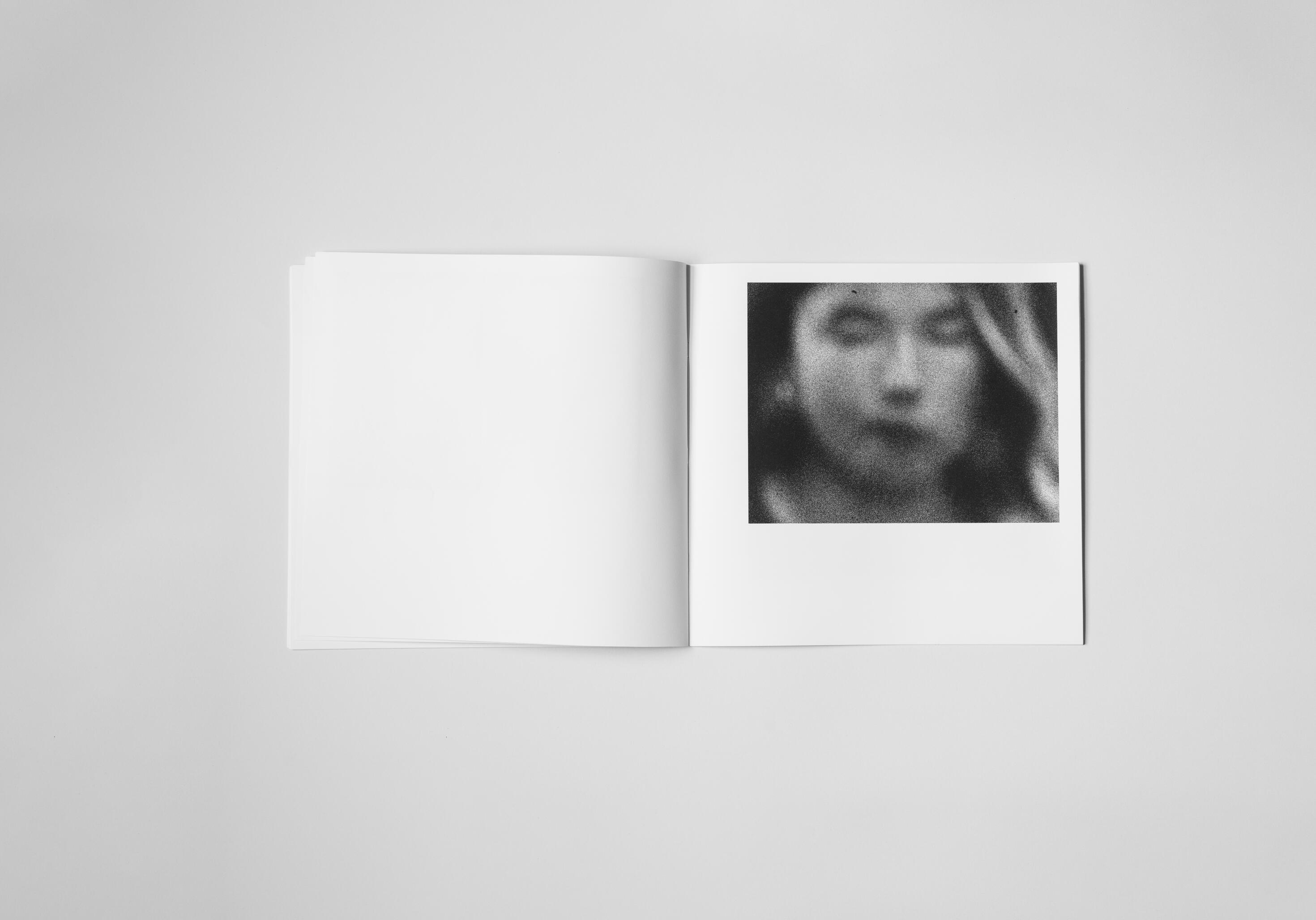 art book with abstract black and white image of a close up face