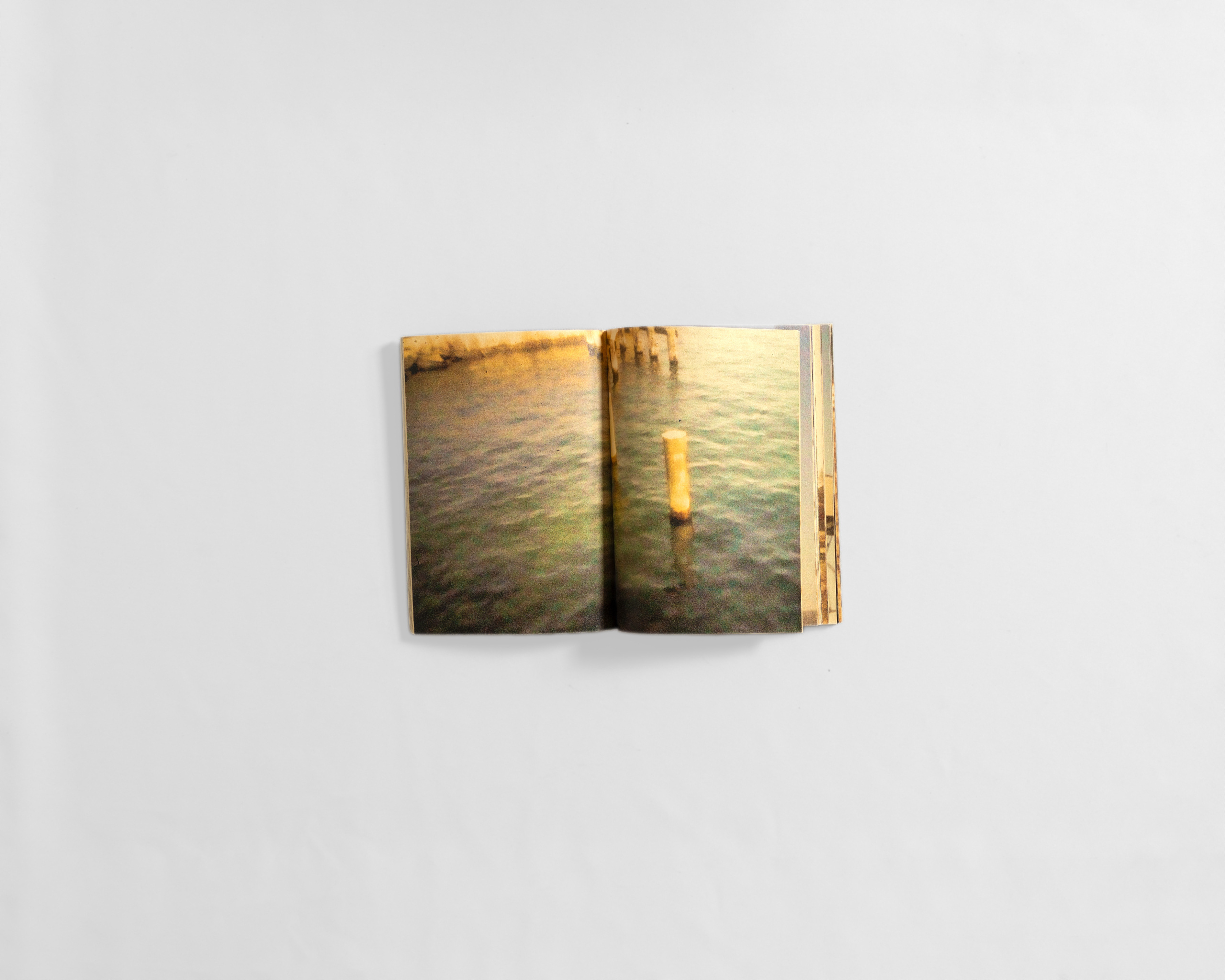 art book with fuzzy colourful image of water