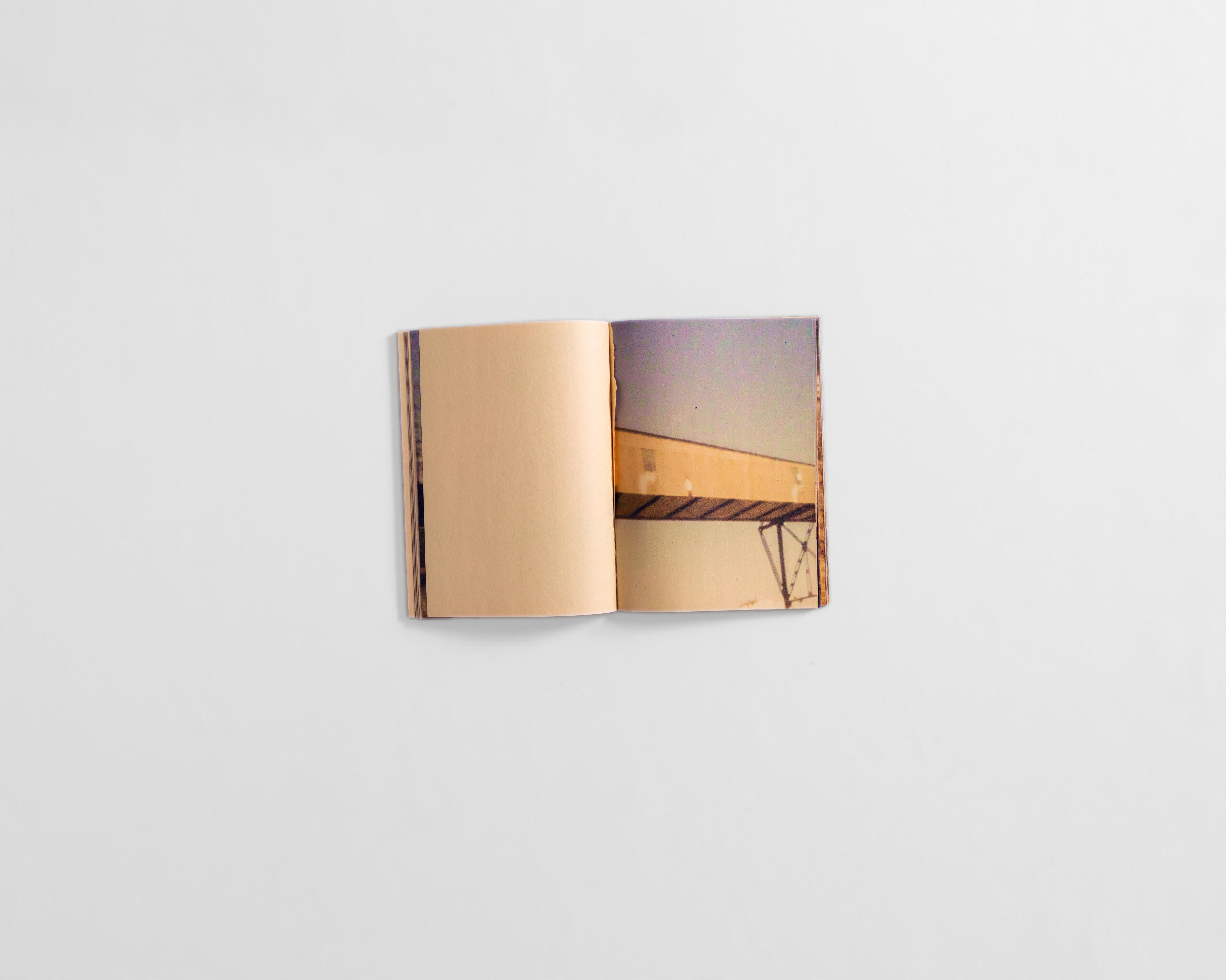 art book with fuzzy colourful image of industrial elevator