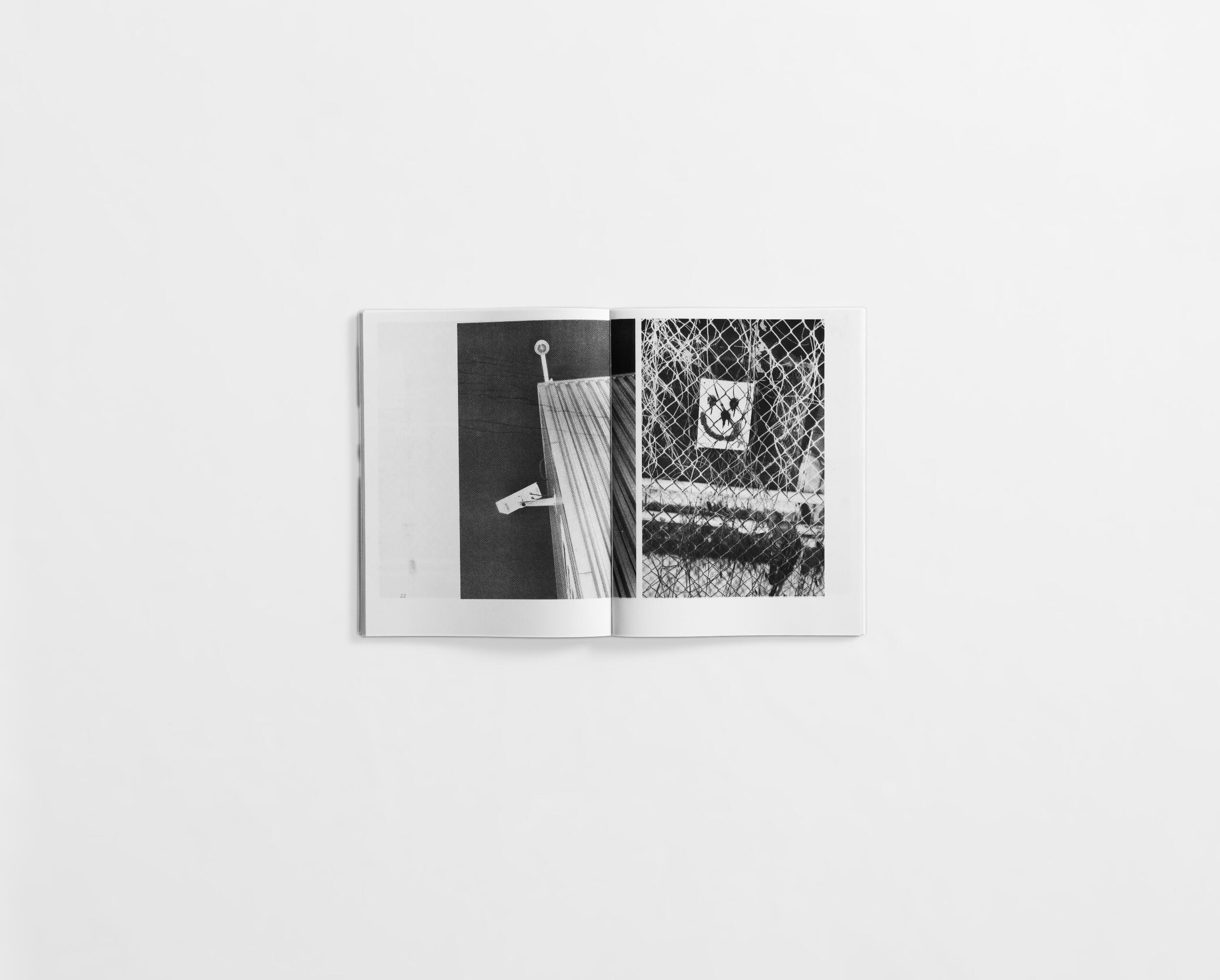 art book with street photography of security cameras at night