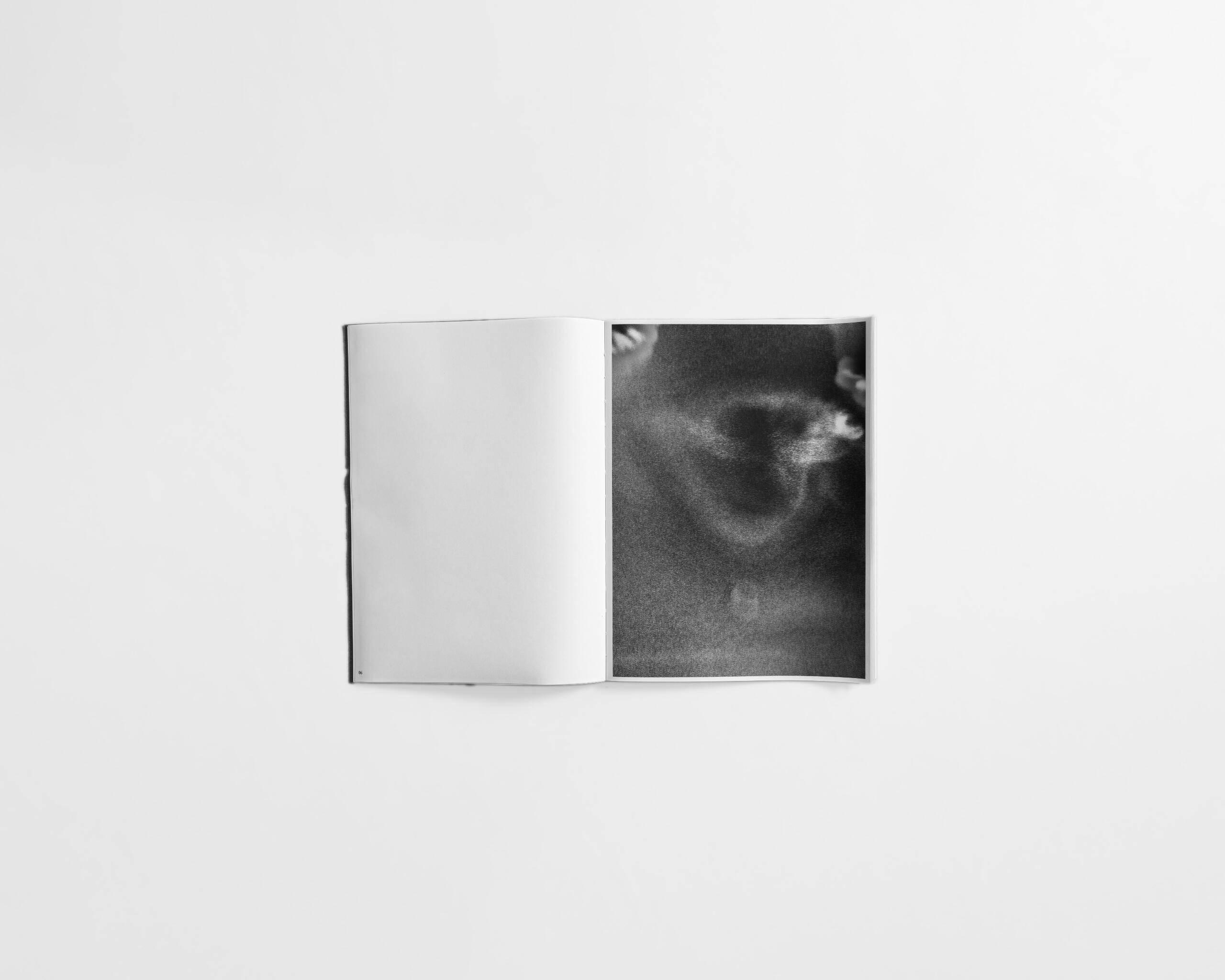 art book with abstract black and white image of a mans face