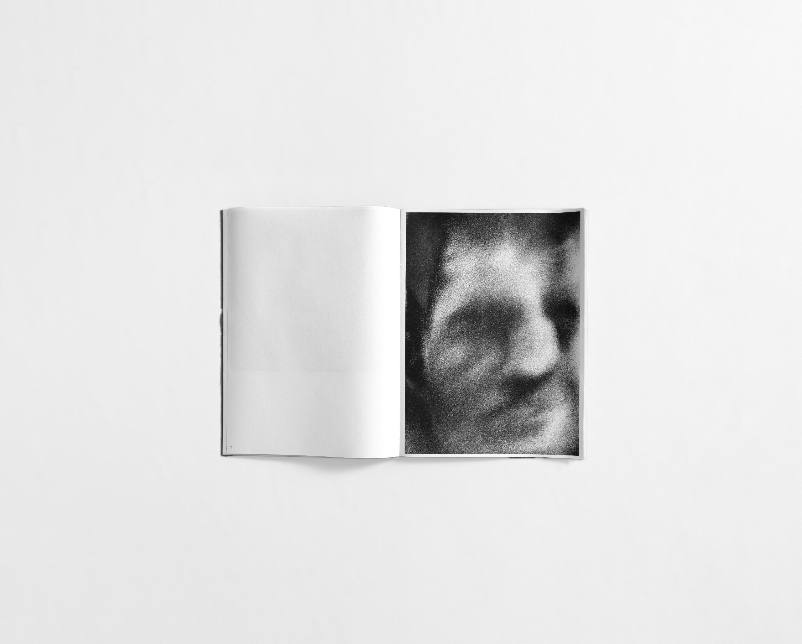 art book with abstract black and white image of a close up face